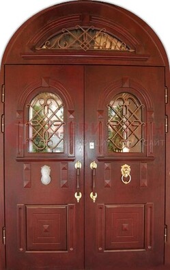 Стальная арочная дверь со стеклом и ковкой ДА-30 в дом из кирпича в Краснознаменске
